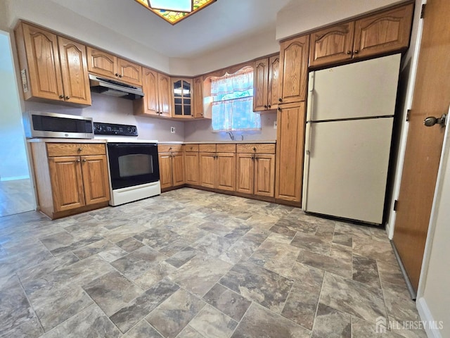 20 Ellingham Ave, Monroe, NJ 08831 - kitchen with electric stove, freestanding refrigerator, under cabinet range hood, stainless steel microwave, and light stone finish floors