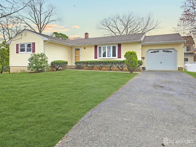 20 Ellingham Ave, Monroe, NJ 08831 - single story home with an attached garage, a chimney, asphalt driveway, and a front yard