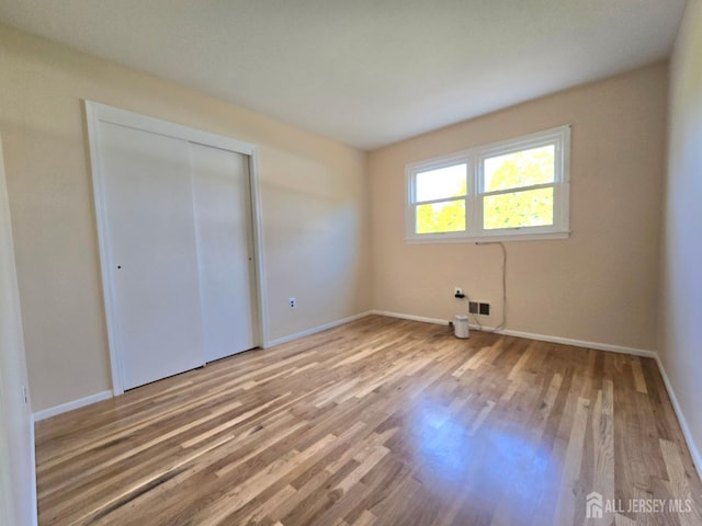 20 Ellingham Ave, Monroe, NJ 08831 - unfurnished bedroom featuring wood finished floors, baseboards, and a closet