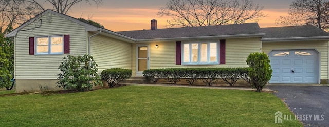 20 Ellingham Ave, Monroe, NJ 08831 - single story home with a chimney, an attached garage, asphalt driveway, and a lawn