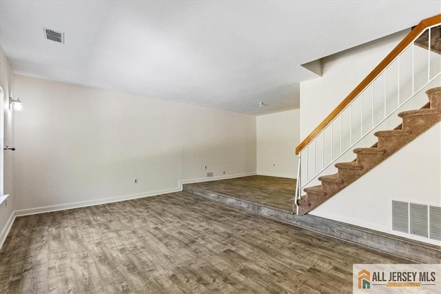 1383 Thomas Ave, North Brunswick, NJ 08902 - unfurnished living room with wood finished floors and stairs