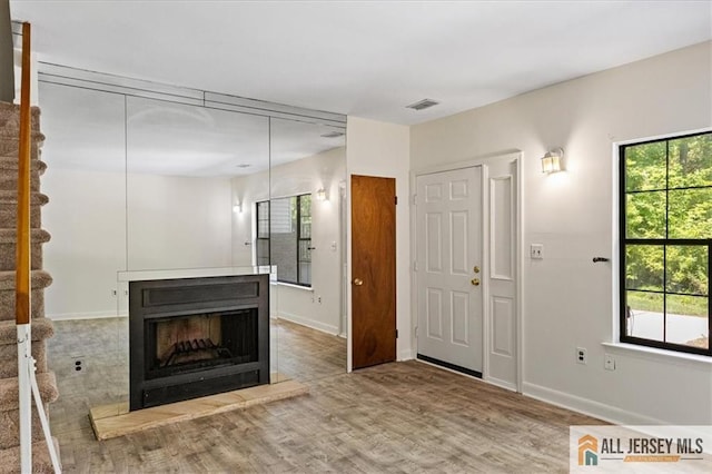 1383 Thomas Ave, North Brunswick, NJ 08902 - entryway featuring wood finished floors and a fireplace with raised hearth