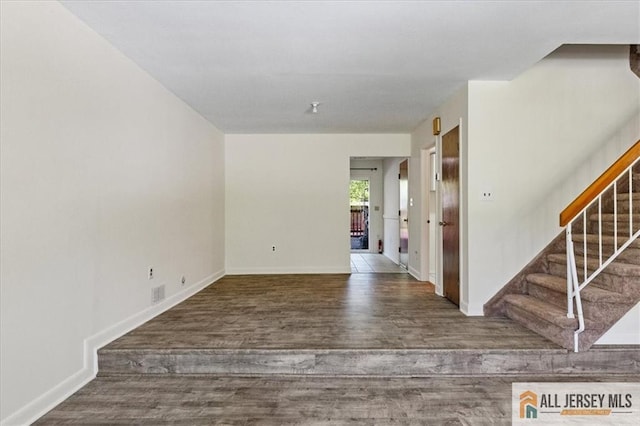 1383 Thomas Ave, North Brunswick, NJ 08902 - empty room featuring wood finished floors and stairway
