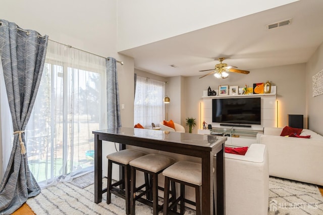 dining room featuring a ceiling fan and visible vents