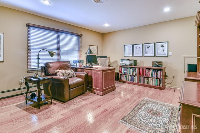 office with light hardwood / wood-style floors