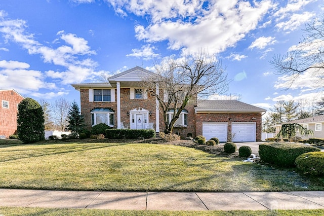 view of front of house featuring a garage and a front lawn