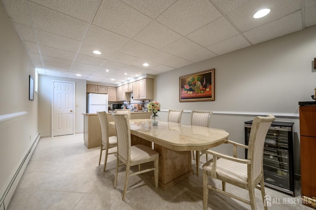 1 Wilfred Rd, Manalapan, NJ 07726 - dining space featuring a baseboard radiator, beverage cooler, a paneled ceiling, recessed lighting, and light tile patterned floors