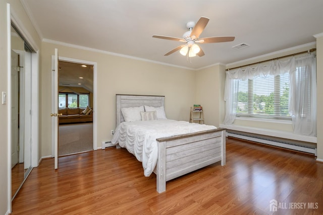 1 Wilfred Rd, Manalapan, NJ 07726 - bedroom with a baseboard heating unit, multiple windows, light wood-type flooring, and ornamental molding