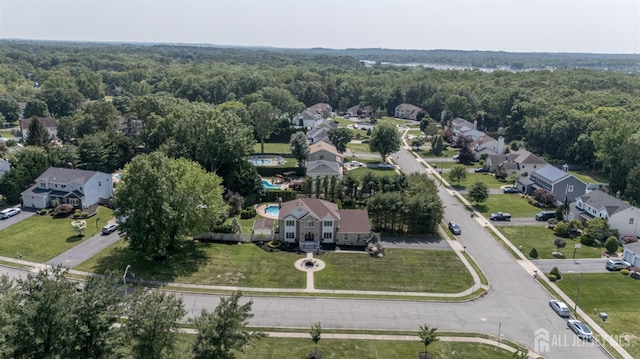 1 Wilfred Rd, Manalapan, NJ 07726 - aerial view of property and surrounding area with a heavily wooded area and nearby suburban area