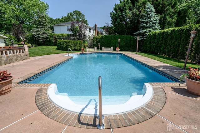 1 Wilfred Rd, Manalapan, NJ 07726 - view of swimming pool featuring a yard and a patio