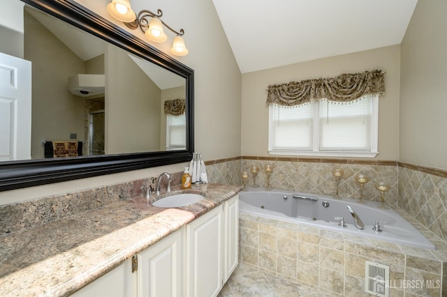 1 Wilfred Rd, Manalapan, NJ 07726 - full bathroom featuring lofted ceiling, a jetted tub, vanity, and a stall shower