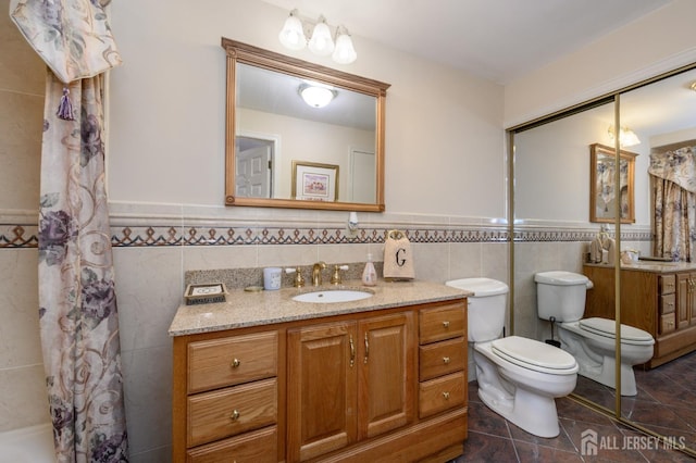 1 Wilfred Rd, Manalapan, NJ 07726 - bathroom featuring tile walls, a wainscoted wall, vanity, and a shower with shower curtain