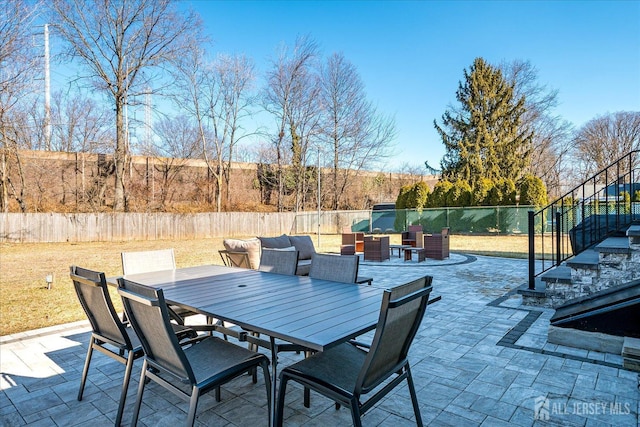 view of patio / terrace with outdoor dining space and fence