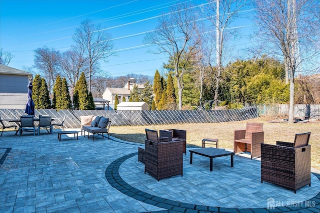 view of patio / terrace featuring an outdoor living space and a fenced backyard