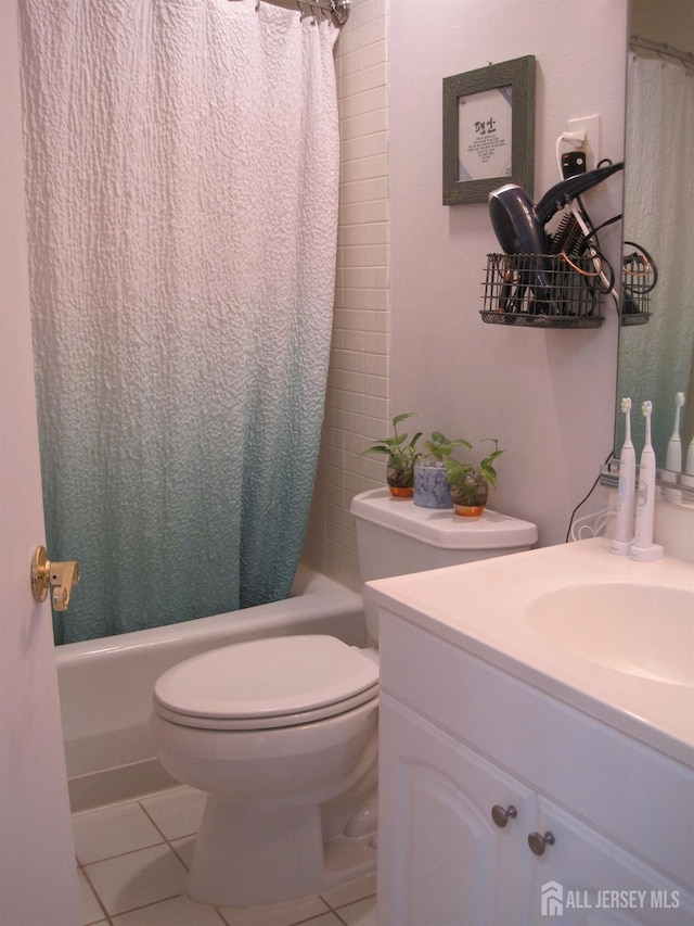 bathroom with vanity, shower / bath combo, tile patterned flooring, and toilet