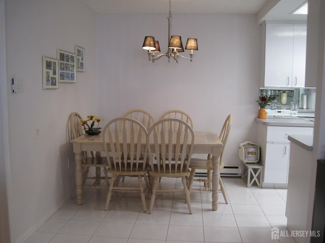 dining space featuring light tile patterned flooring and an inviting chandelier