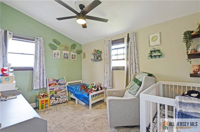 bedroom featuring lofted ceiling and a ceiling fan
