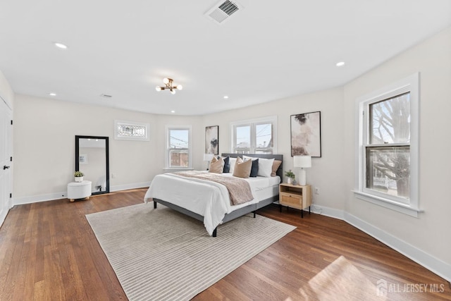 bedroom featuring visible vents, recessed lighting, baseboards, and wood finished floors