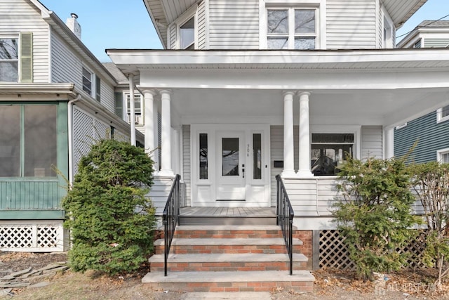 entrance to property with a porch