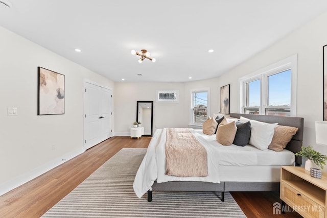 bedroom featuring recessed lighting, baseboards, and wood finished floors