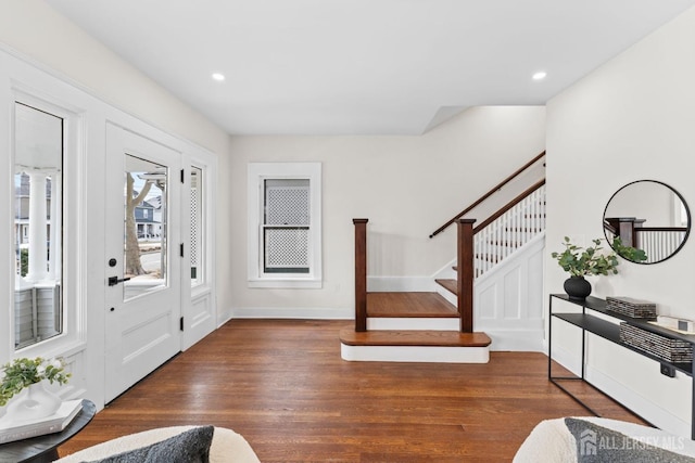 foyer entrance featuring stairs, recessed lighting, wood finished floors, and baseboards