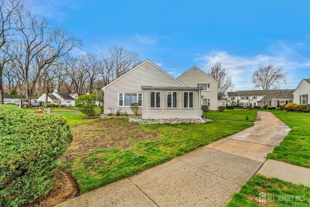 309 Sharon Way Unit A, Monroe, NJ 08831 - view of home's exterior with a lawn