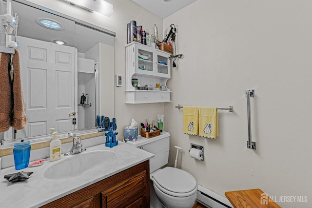 309 Sharon Way Unit A, Monroe, NJ 08831 - bathroom featuring vanity, toilet, baseboard heating, and a shower