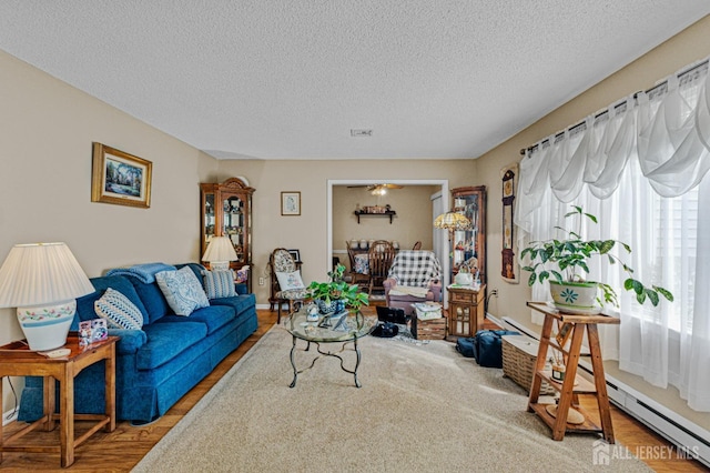 309 Sharon Way Unit A, Monroe, NJ 08831 - living area featuring a textured ceiling, visible vents, and wood finished floors