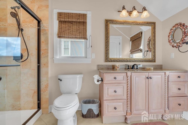 bathroom with a shower stall, tile patterned floors, vanity, and toilet