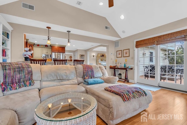living room with light wood finished floors and visible vents