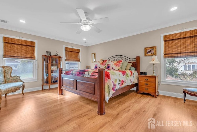 bedroom with multiple windows, baseboards, and ornamental molding