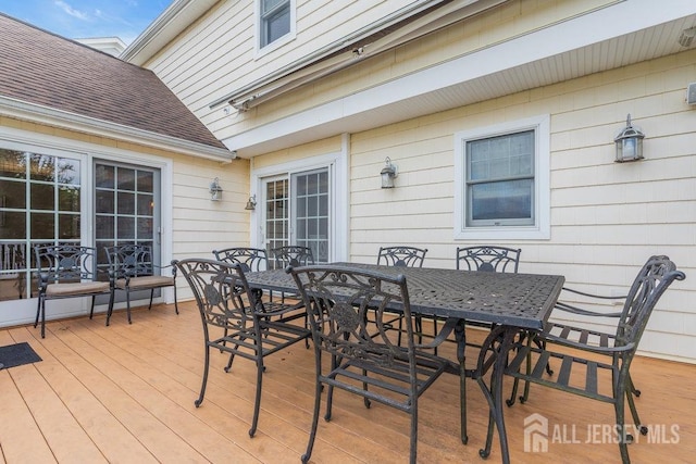 deck featuring outdoor dining area