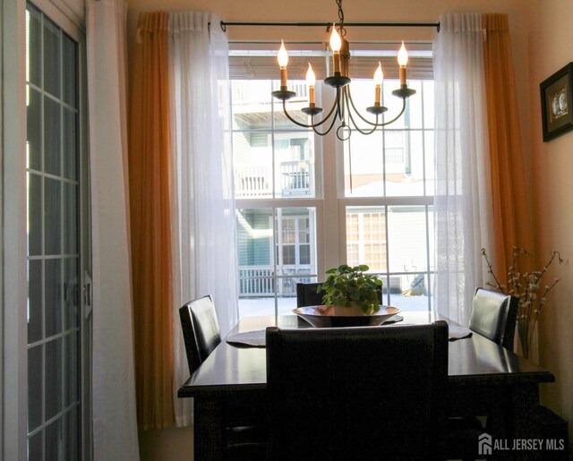 dining room with a chandelier and a wealth of natural light