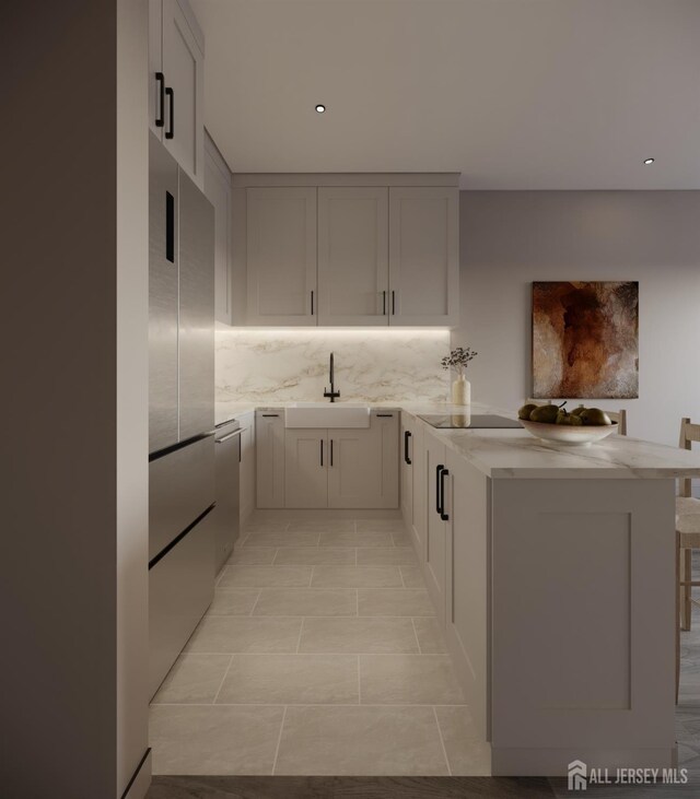 335 21st St, Irvington, NJ 07111 - kitchen featuring tasteful backsplash, recessed lighting, stainless steel appliances, a sink, and a peninsula