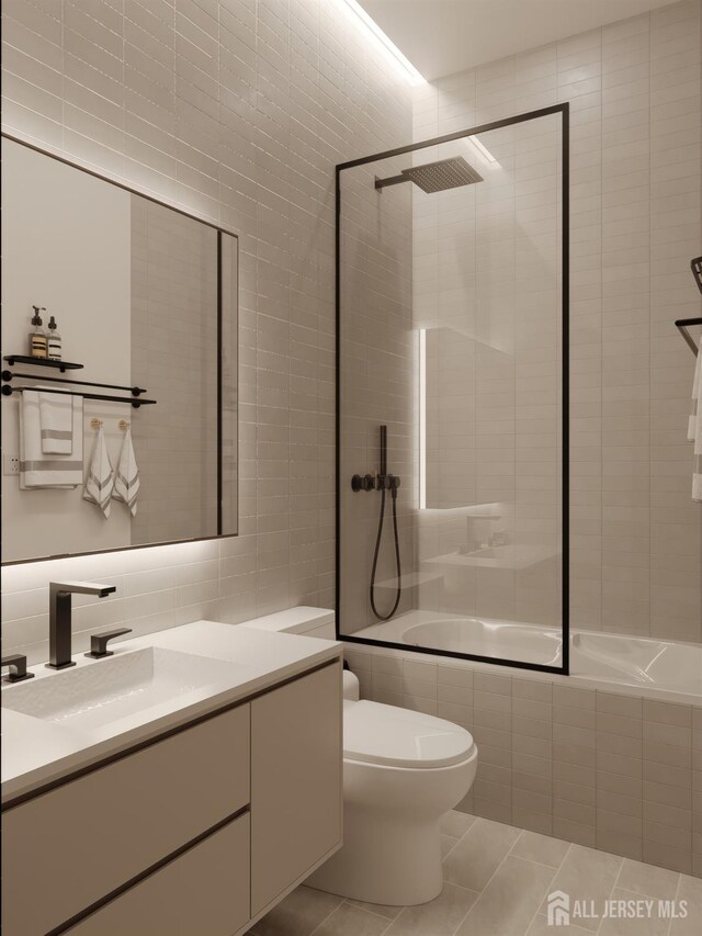 335 21st St, Irvington, NJ 07111 - bathroom featuring tile walls, vanity, tile patterned floors, toilet, and tiled shower / bath combo