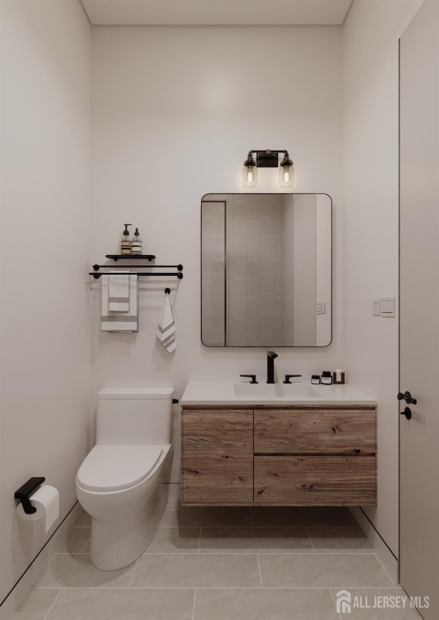 335 21st St, Irvington, NJ 07111 - half bath featuring toilet, tile patterned flooring, and vanity