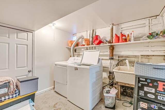 washroom featuring separate washer and dryer and sink