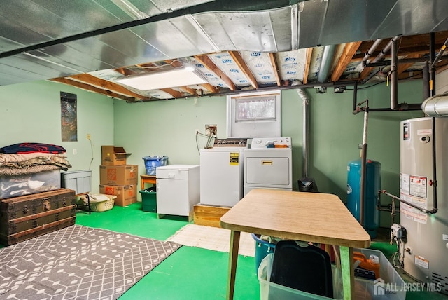 basement featuring washing machine and clothes dryer and gas water heater