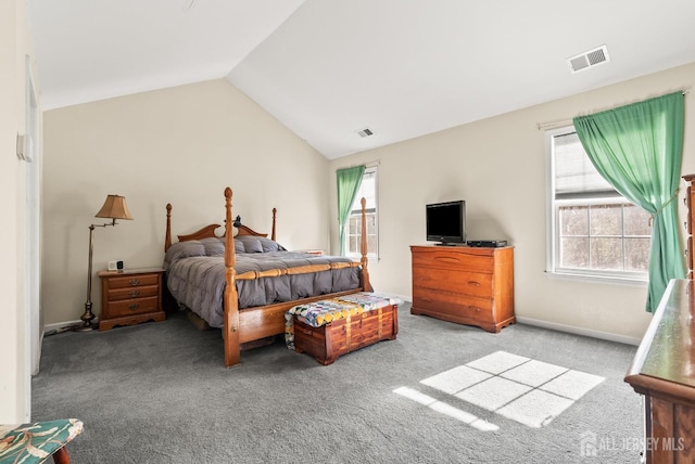 bedroom featuring light colored carpet and vaulted ceiling