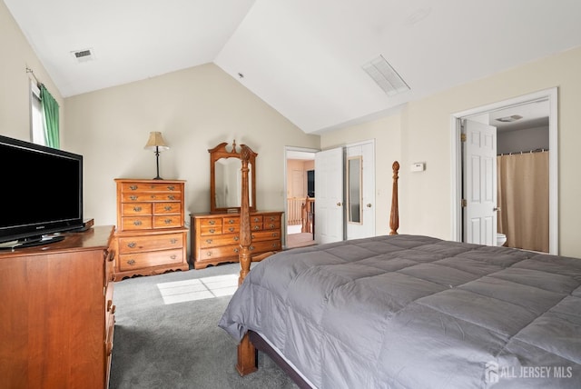 carpeted bedroom with vaulted ceiling