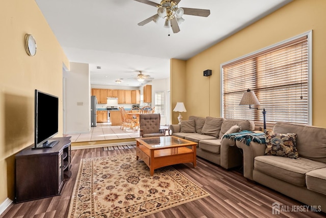 living room with hardwood / wood-style flooring and ceiling fan