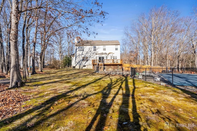 rear view of house with a yard