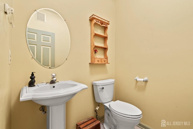 bathroom featuring toilet