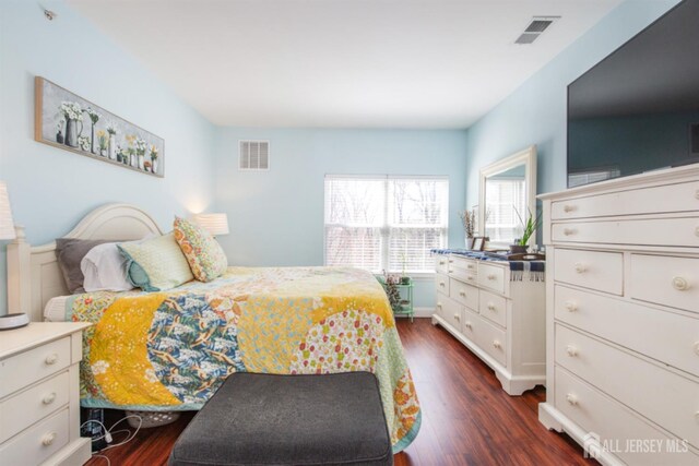 238 Lucy Ct, South Plainfield, NJ 07080 - bedroom with dark wood finished floors and visible vents