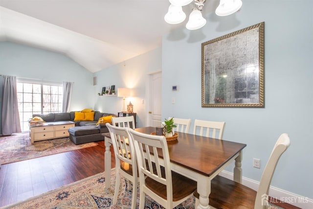 238 Lucy Ct, South Plainfield, NJ 07080 - dining space featuring a chandelier, vaulted ceiling, and wood finished floors
