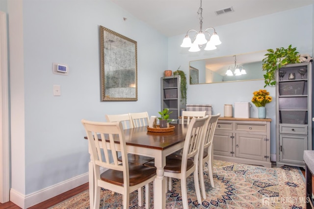 238 Lucy Ct, South Plainfield, NJ 07080 - dining room with wood finished floors, visible vents, a notable chandelier, and baseboards