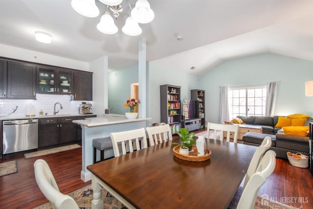 238 Lucy Ct, South Plainfield, NJ 07080 - dining area featuring a notable chandelier, dark wood-type flooring, and vaulted ceiling