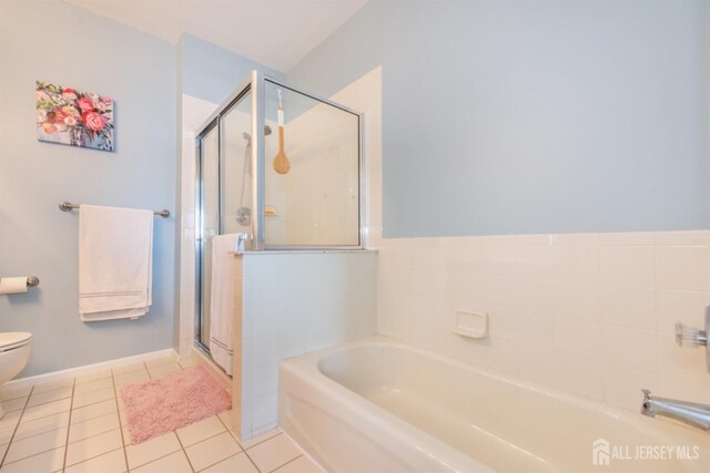 238 Lucy Ct, South Plainfield, NJ 07080 - full bathroom featuring tile patterned floors, a stall shower, a garden tub, and toilet