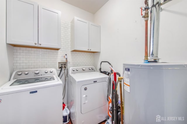 238 Lucy Ct, South Plainfield, NJ 07080 - laundry room with water heater, washing machine and clothes dryer, and cabinet space