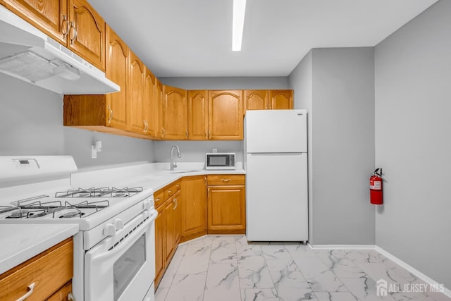 450 College Dr, Edison, NJ 08817 - kitchen featuring white appliances, under cabinet range hood, light marble finish flooring, and light countertops